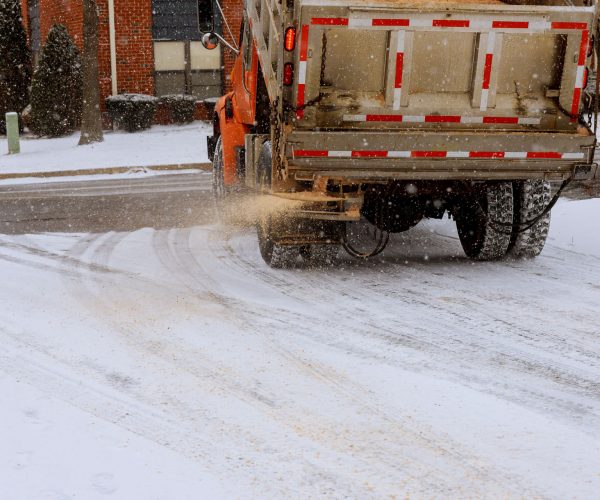 municipal car for sprinkle half the salt and sand on roads with snow municipal car for sprinkle half the salt and sand on roads with snow machine for sprinkling sand roads