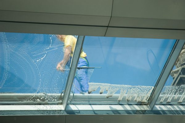 worker cleaning windows worker cleaning windows